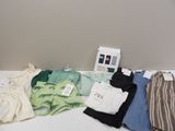 a lot of clothes that are sitting on a table