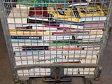 a cart full of books sitting on the floor