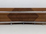 wooden and chrome plate holder with a wooden tray on top of it