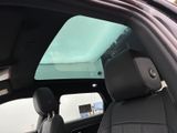 a view of the sunroof from inside of a car