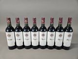six bottles of wine lined up in a row on a table