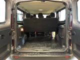 the back of a van with the doors open and the seats down