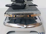 several pans and pans are stacked on top of each other on a scale