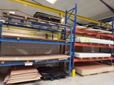 many shelves that have different types of wood on them