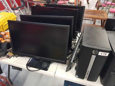a lot of computer equipment on the table
