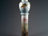 an image of a vase sitting on top of a wooden stand