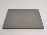 a laptop that is sitting on a white surface