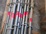 a pile of metal pipes sitting on a pallet