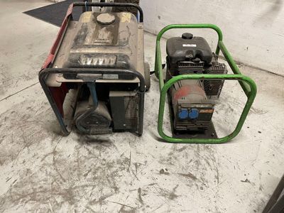 two small generators sitting next to each other on the floor