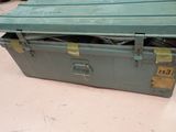 a green box that is sitting on the floor