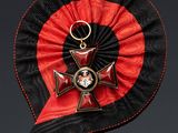 a red and black ribbon with a cross on it