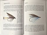 a book with a picture of a fly and a book with a picture of a fly