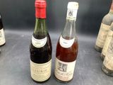 several bottles of wine are lined up on a table