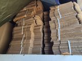 a large amount of stacks of money sitting in a box