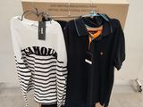two shirts hanging on a rack in front of a cardboard box