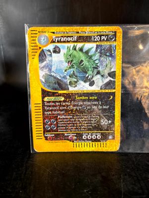 the card is in a clear plastic box on a table