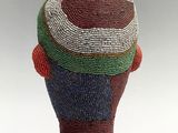 a sculpture of a man with a hat on it ' s head
