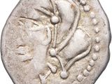 une pièce d'argent sur laquelle figure une tête de femme