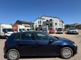 the car is parked in the parking lot outside of the building
