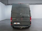 a grey van that is parked in a room