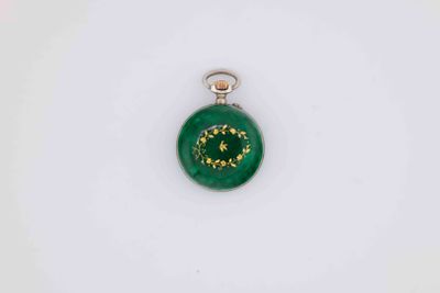 a close up of a green christmas ornament on a white surface
