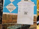 a picture of a car on a table next to a record
