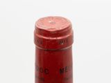 a close up of a bottle of wine on a table
