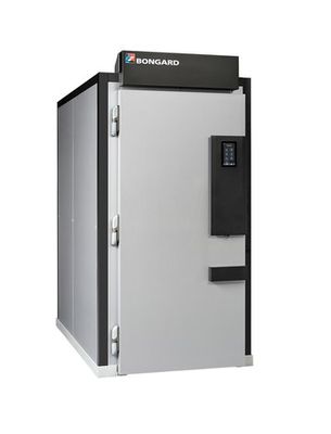 a white and black refrigerator sitting on top of a white surface