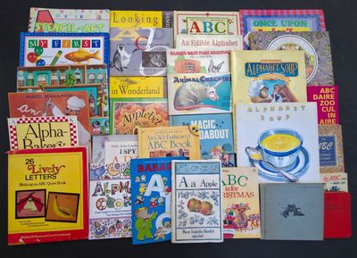a lot of children ' s books that are on the table