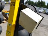 a traffic light that has a box on top of it