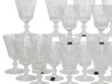 a lot of wine glasses that are sitting on a table