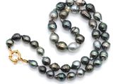 the necklace is made of black pearls and gold