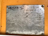 a close up of a metal plate on a construction vehicle