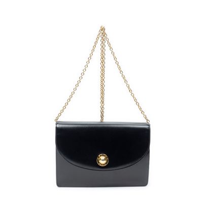 a black purse with a gold clasp and chain