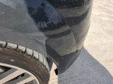 a close up of a car ' s tire on the street