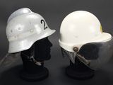 two helmets that are sitting next to each other