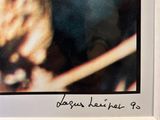 a polaroid picture of a man playing drums