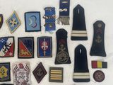 many different types of military badges on a white surface