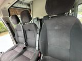 two seats in the back of a van that are empty