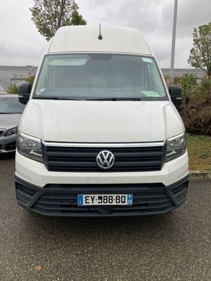 a white van that is parked in a parking lot