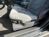 a seat in the back of a car with the door open