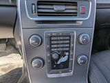 the interior of a car with a radio and a steering control