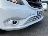 a close up of the front of a white car