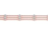 un bracelet en or rose serti de diamants sur fond blanc