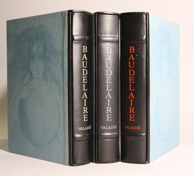 three books are stacked on top of each other on a table