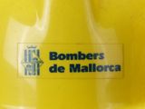 a yellow container with a sticker that says bombers de mallorca