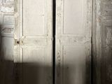 two white doors that are open in a room