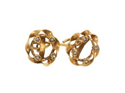 an image of a pair of gold earrings on a white background