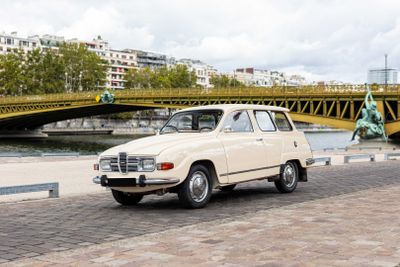 a white car that is parked on the side of the road