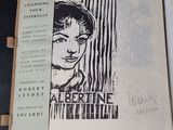 an open book with a drawing of a woman on it